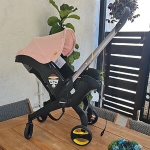 Doona Infant Car Seat Stroller - Pink and Black